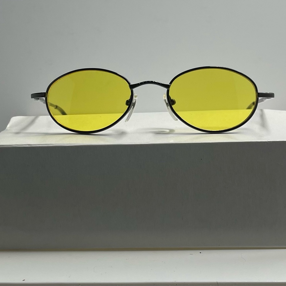 Classy retro dark gray metal frame with yellow lens.